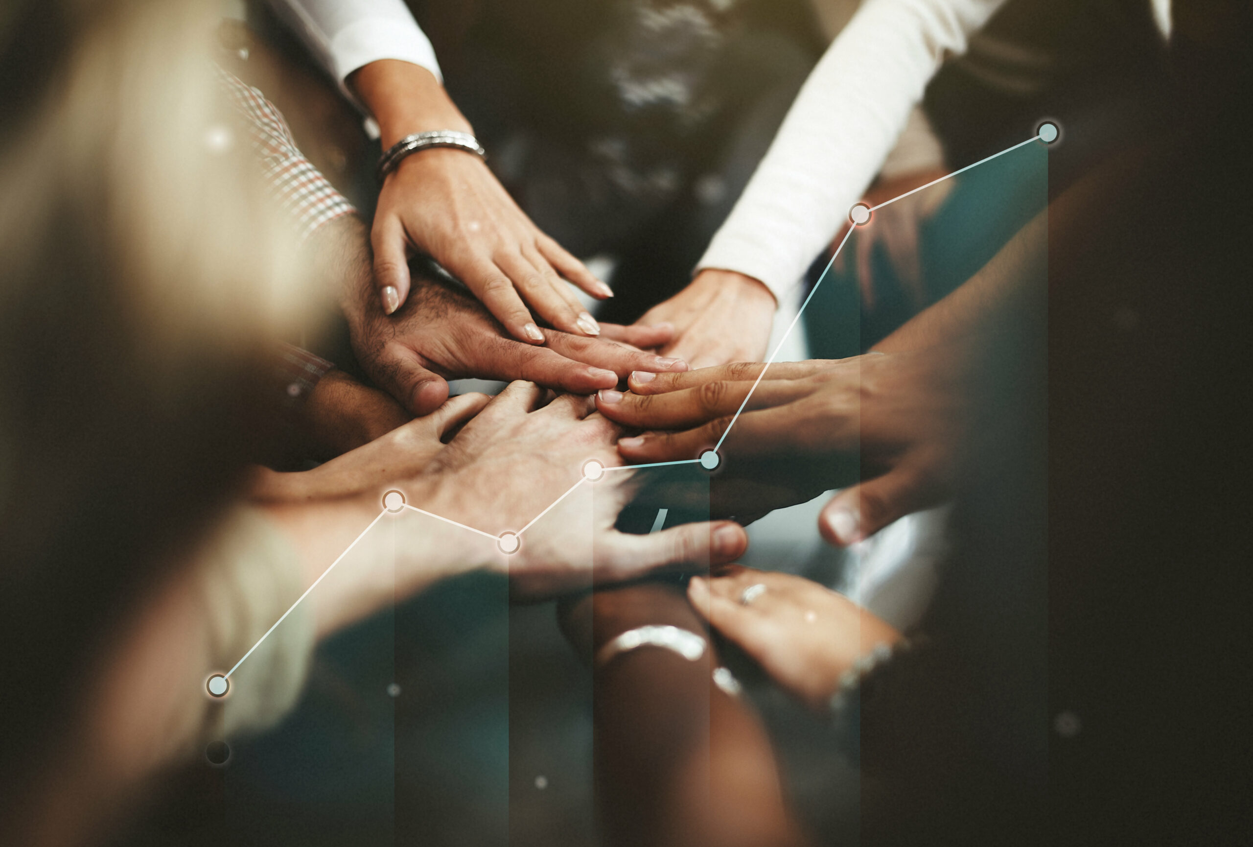 People joining hands in the middle