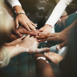 People joining hands in the middle